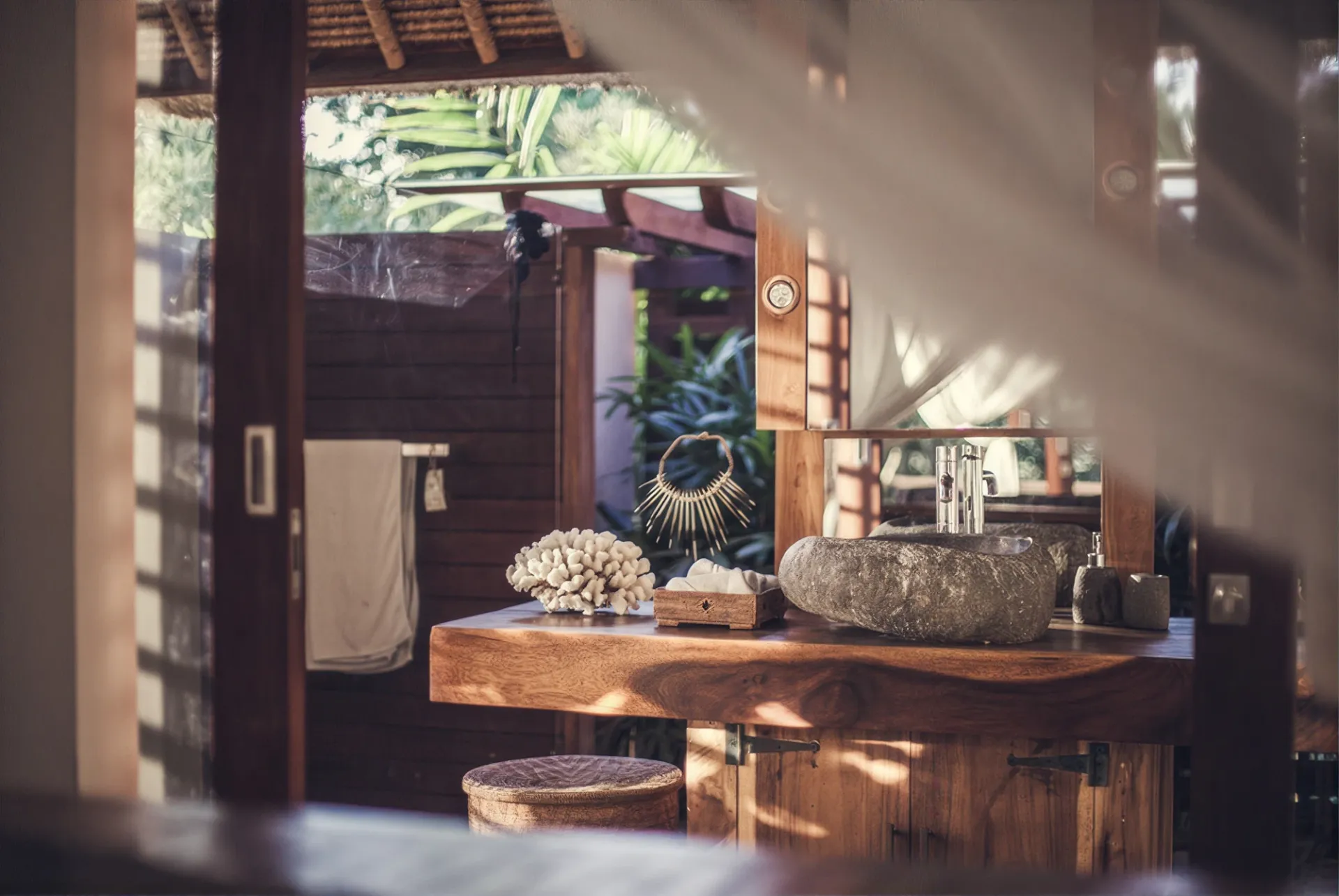 Open-air shower among tropical foliage